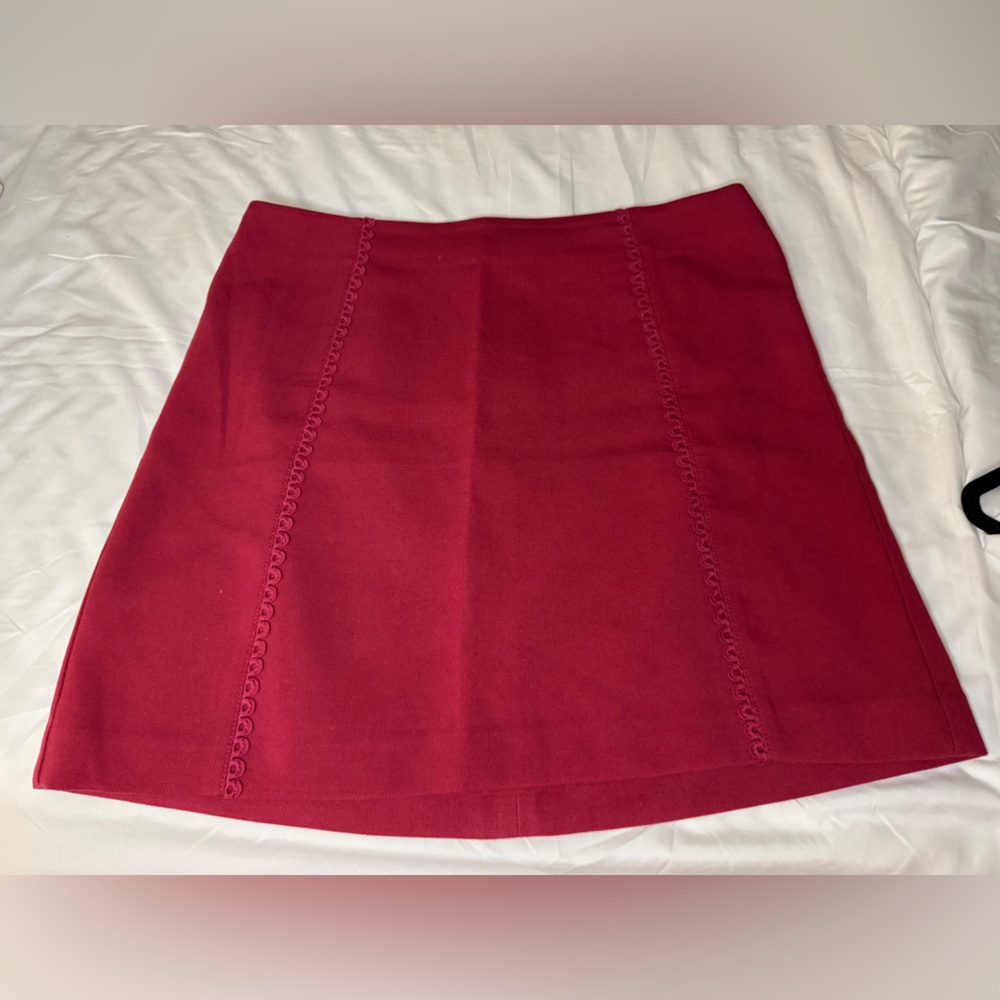 Pretty cranberry red skirt. Detailing on the front.